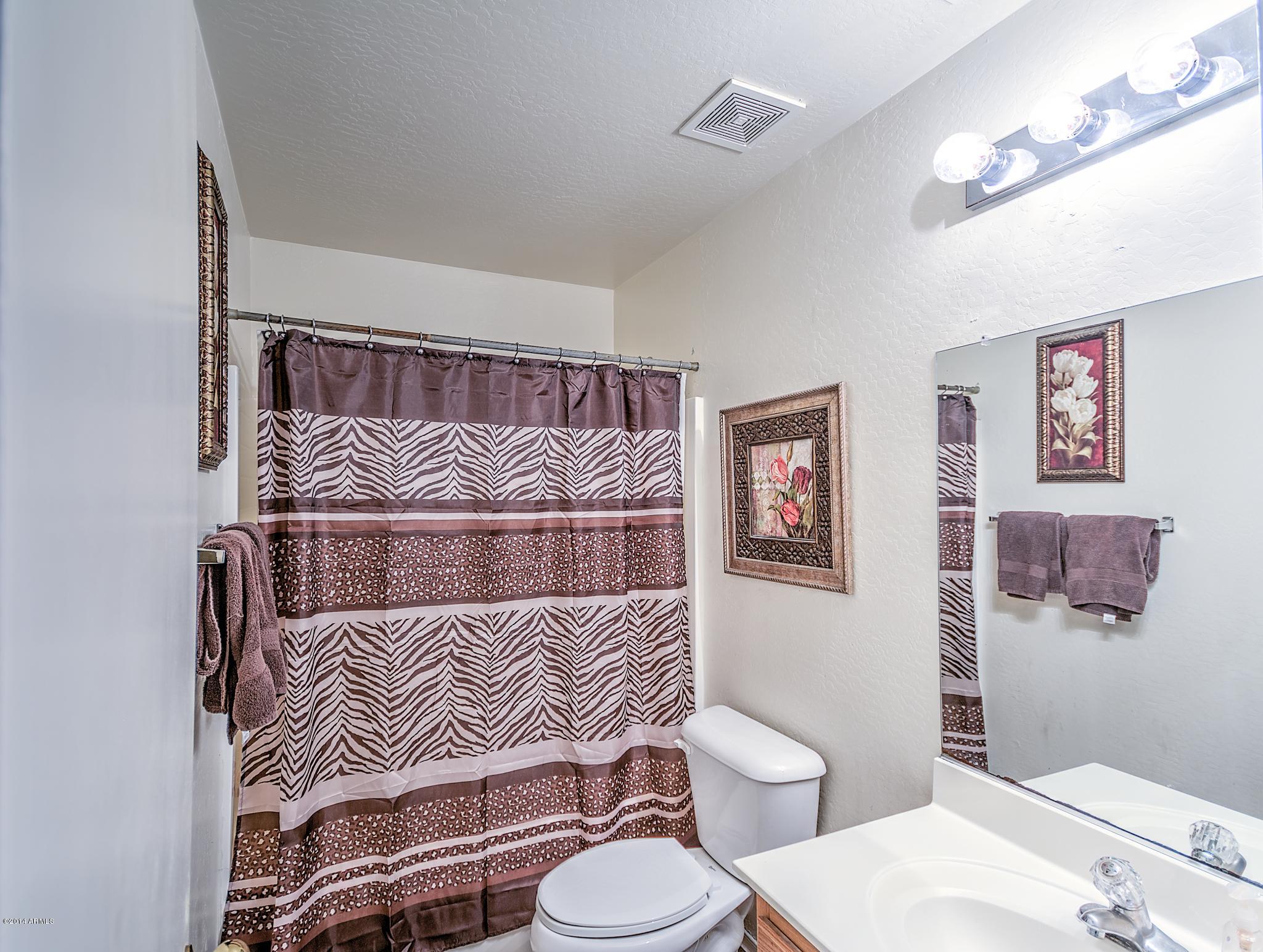 8421 West Payson Road Tolleson, AZ 85353 - Photo 4 of 16 Full bathroom downstairs
