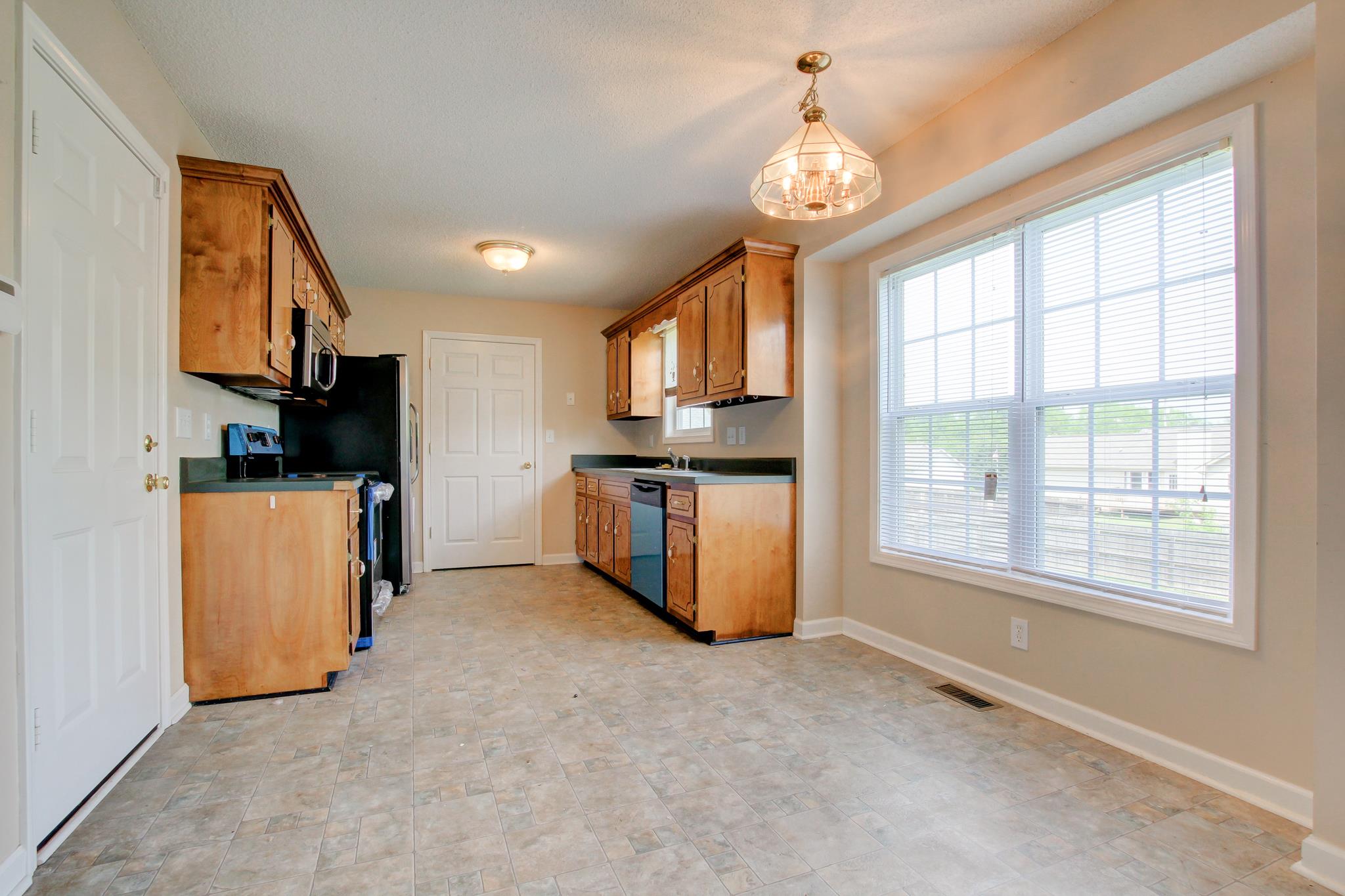 1931 Needmore Road Clarksville, TN 37042 - Photo 4 of 25 Eat in kitchen with laundry closet and all new stainless steel appliances.