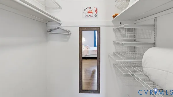 a bathroom with a sink a toilet and shower curtain