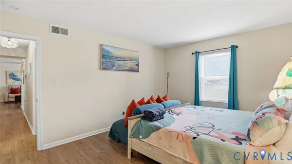 a bedroom with a bed and a table in it