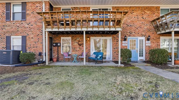 a front view of a house with outdoor seating