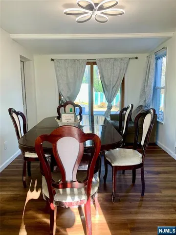 a view of a dining room with furniture and window