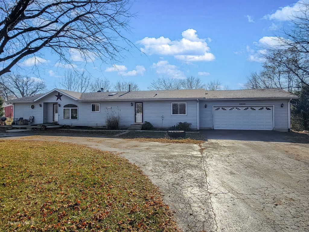 22105 Anthony Road Marengo, IL 60152 - Photo 2 of 27 a view of a house with a yard and a large tree