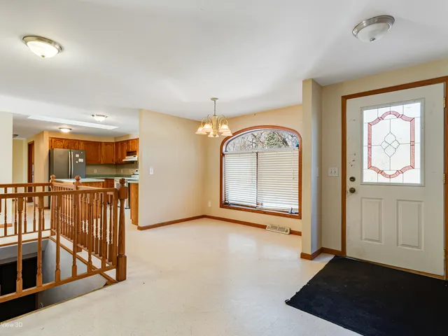 a kitchen with stainless steel appliances granite countertop wooden cabinets a sink and a stove