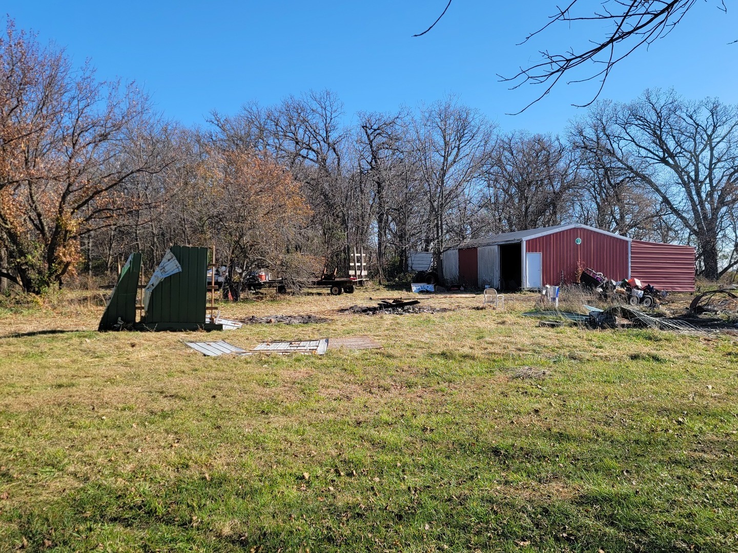 22105 Anthony Road Marengo, IL 60152 - Photo 9 of 27 a view of large house with a yard covered with snow and trees