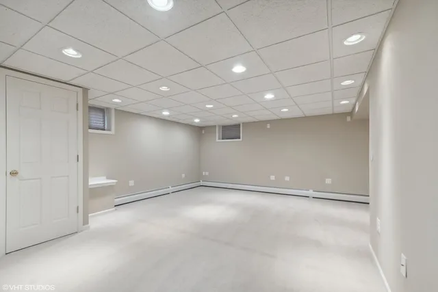 an empty room with a empty space and windows