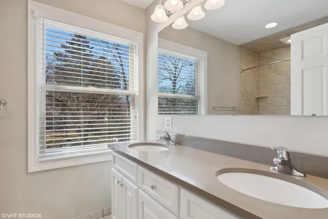 a bathroom with a sink a vanity and a mirror