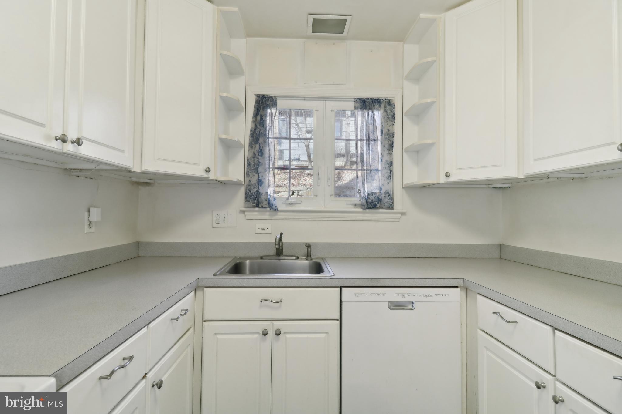 14 Park Valley Road Silver Spring, MD 20910 - Photo 16 of 63 a kitchen with a sink cabinets and window