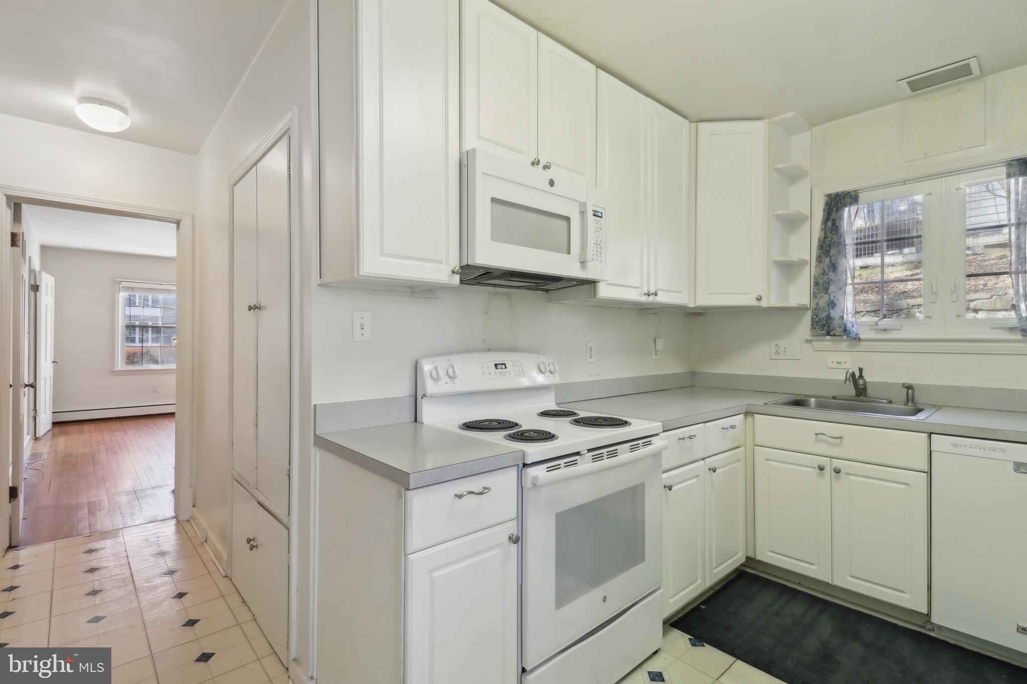 14 Park Valley Road Silver Spring, MD 20910 - Photo 18 of 63 a kitchen with stainless steel appliances granite countertop a sink stove and cabinets