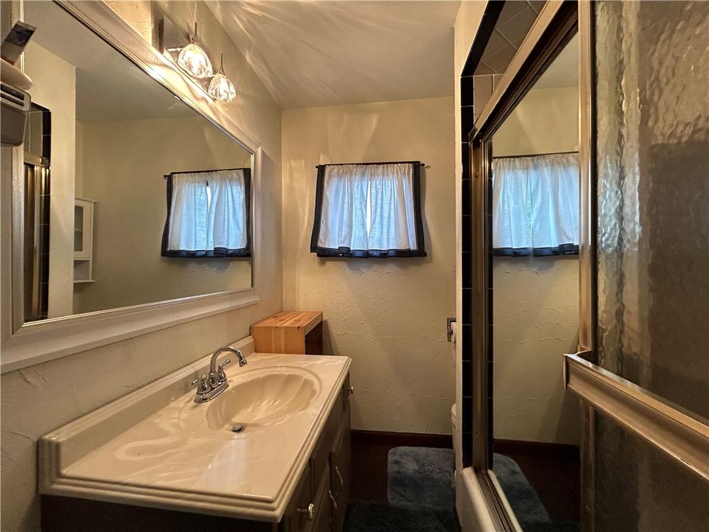 527 Carbon Street Butler, PA 16001 - Photo 12 of 19 a bathroom with a sink and a mirror