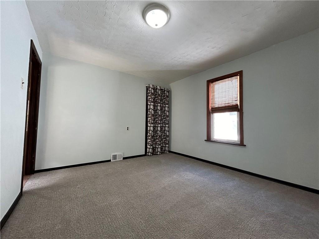 527 Carbon Street Butler, PA 16001 - Photo 10 of 19 an empty room with windows