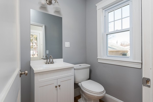 39 Willoughby Road Milton, MA 02186 - Photo 11 of 20 a bathroom with a sink a toilet and a window