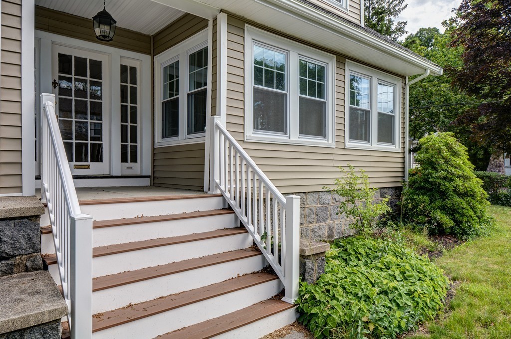 39 Willoughby Road Milton, MA 02186 - Photo 15 of 20 a view of a house with more windows and flower plants