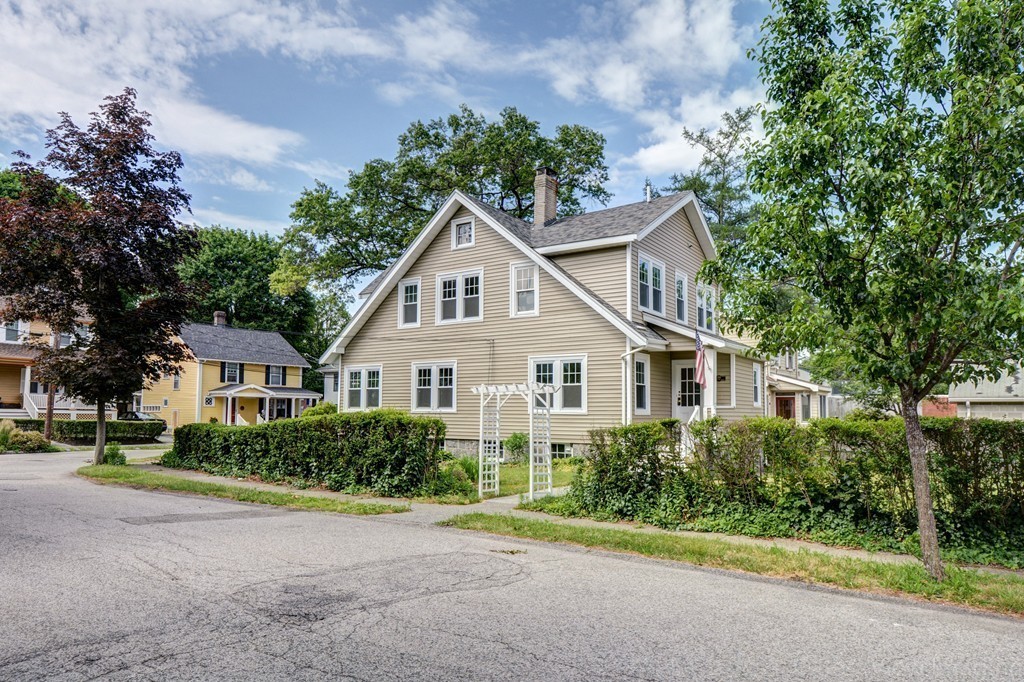 39 Willoughby Road Milton, MA 02186 - Photo 17 of 20 a front view of a house with a garden and plants