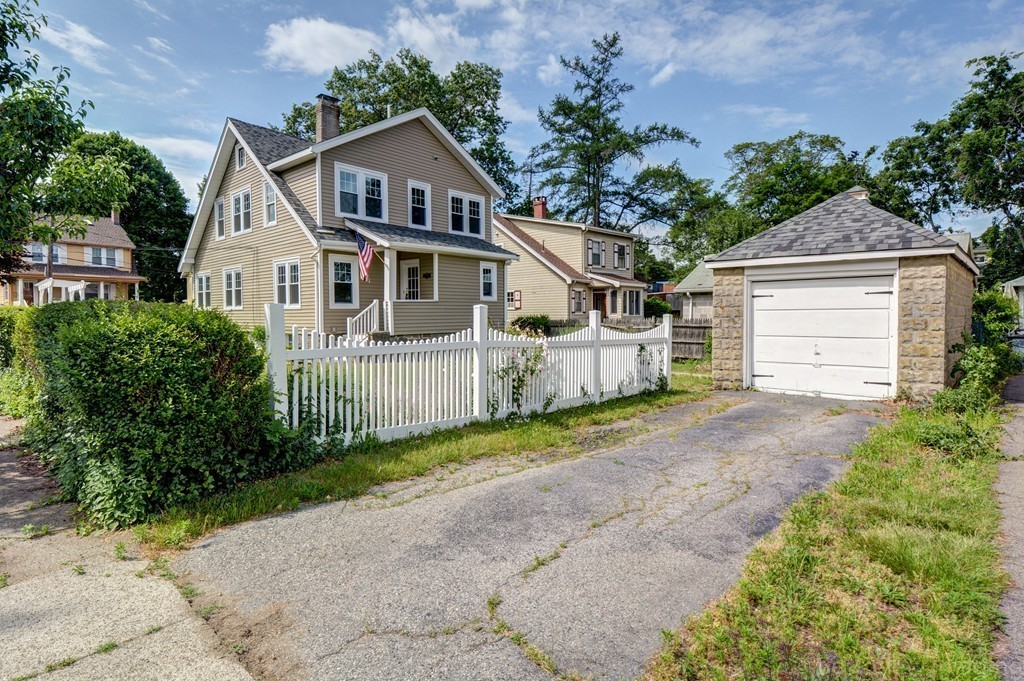 39 Willoughby Road Milton, MA 02186 - Photo 19 of 20 a front view of a house with a yard and garage