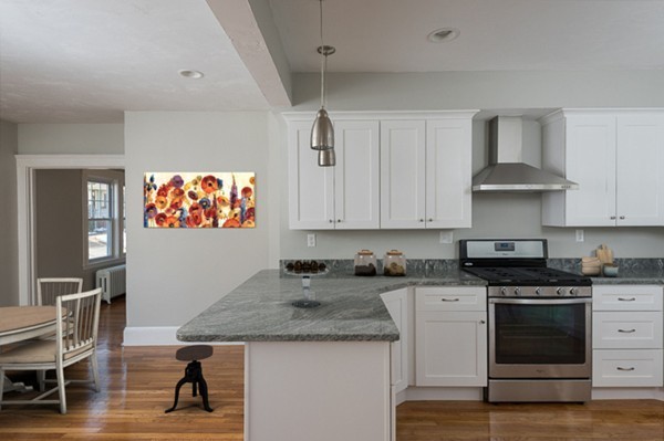 39 Willoughby Road Milton, MA 02186 - Photo 3 of 20 a kitchen with stainless steel appliances granite countertop a stove a sink and a white cabinets