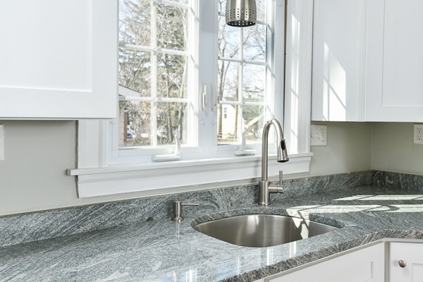 39 Willoughby Road Milton, MA 02186 - Photo 5 of 20 a kitchen with granite countertop a sink and a window