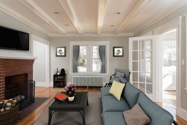 39 Willoughby Road Milton, MA 02186 - Photo 6 of 20 a living room with furniture a flat screen tv and a fireplace