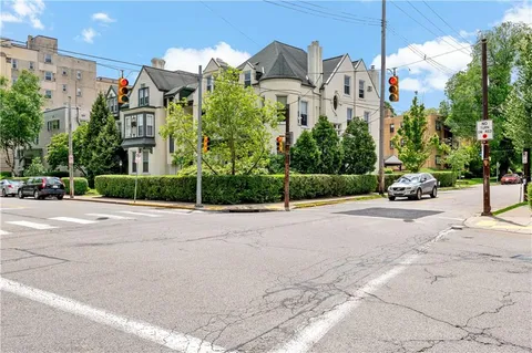 a view of a street with a building in front of it