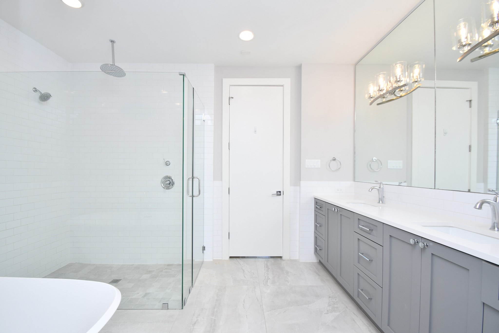 818 Knox Street Houston, TX 77007 - Photo 24 of 39 a spacious bathroom with a double vanity sink a toilet and a shower