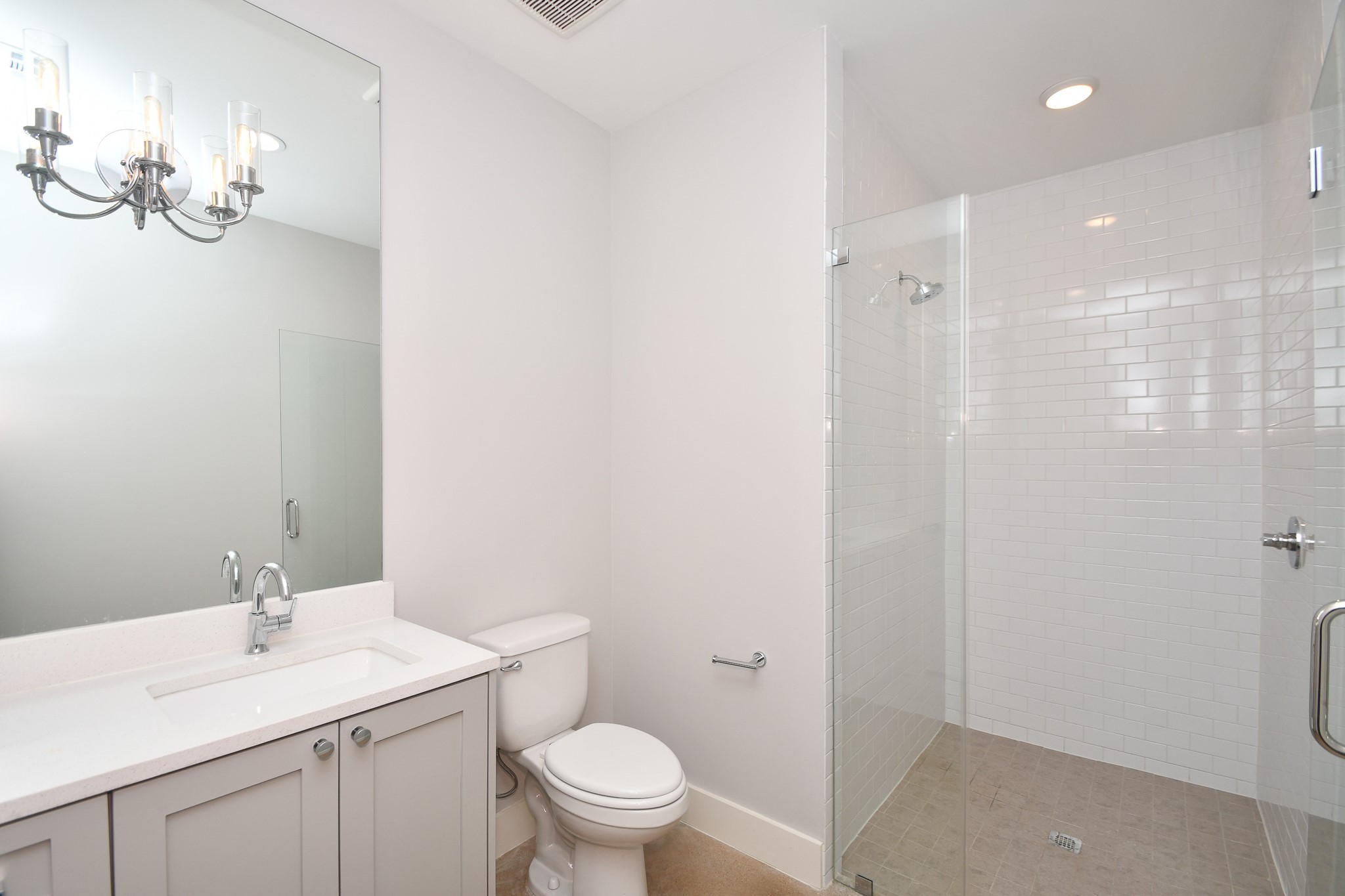 818 Knox Street Houston, TX 77007 - Photo 33 of 39 a bathroom with a toilet a sink and mirror