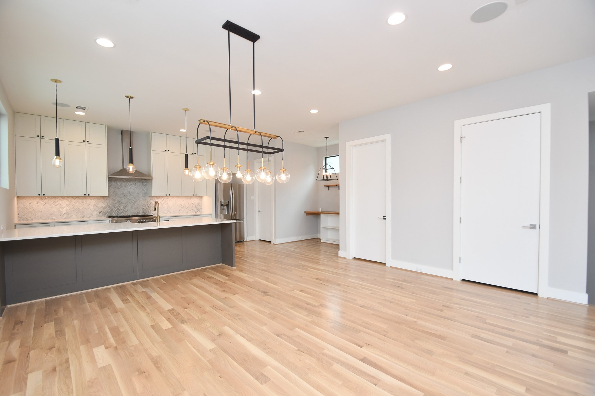 818 Knox Street Houston, TX 77007 - Photo 7 of 39 a view of a kitchen with a sink and cabinets