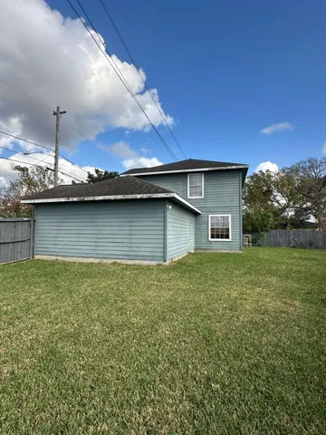 a view of outdoor kitchen with stove and kitchen island