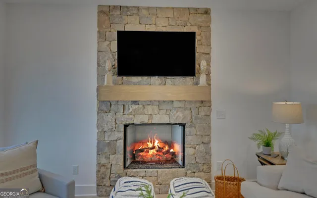 a living room with furniture a fireplace and a fireplace