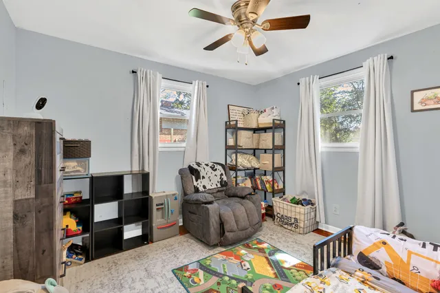 a living room with furniture and a window