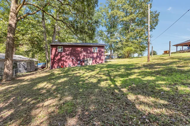 a sign that is sitting in the middle of a field
