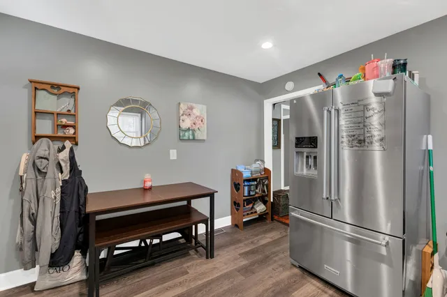 a kitchen with stainless steel appliances a refrigerator and a stove top oven
