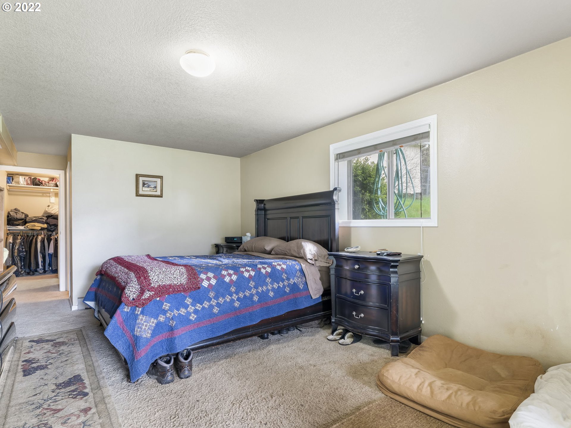39530 Southwest Gibson Road Gaston, OR 97119 - Photo 16 of 31 a bedroom with a bed and wooden floor