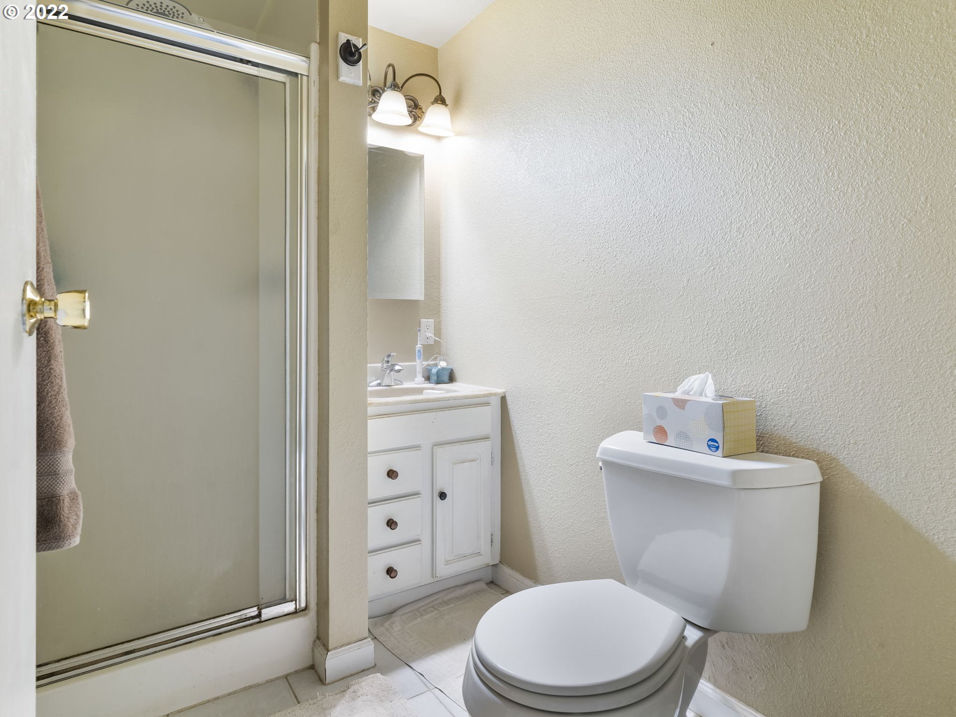 39530 Southwest Gibson Road Gaston, OR 97119 - Photo 17 of 31 a bathroom with a toilet a sink a shower and mirror
