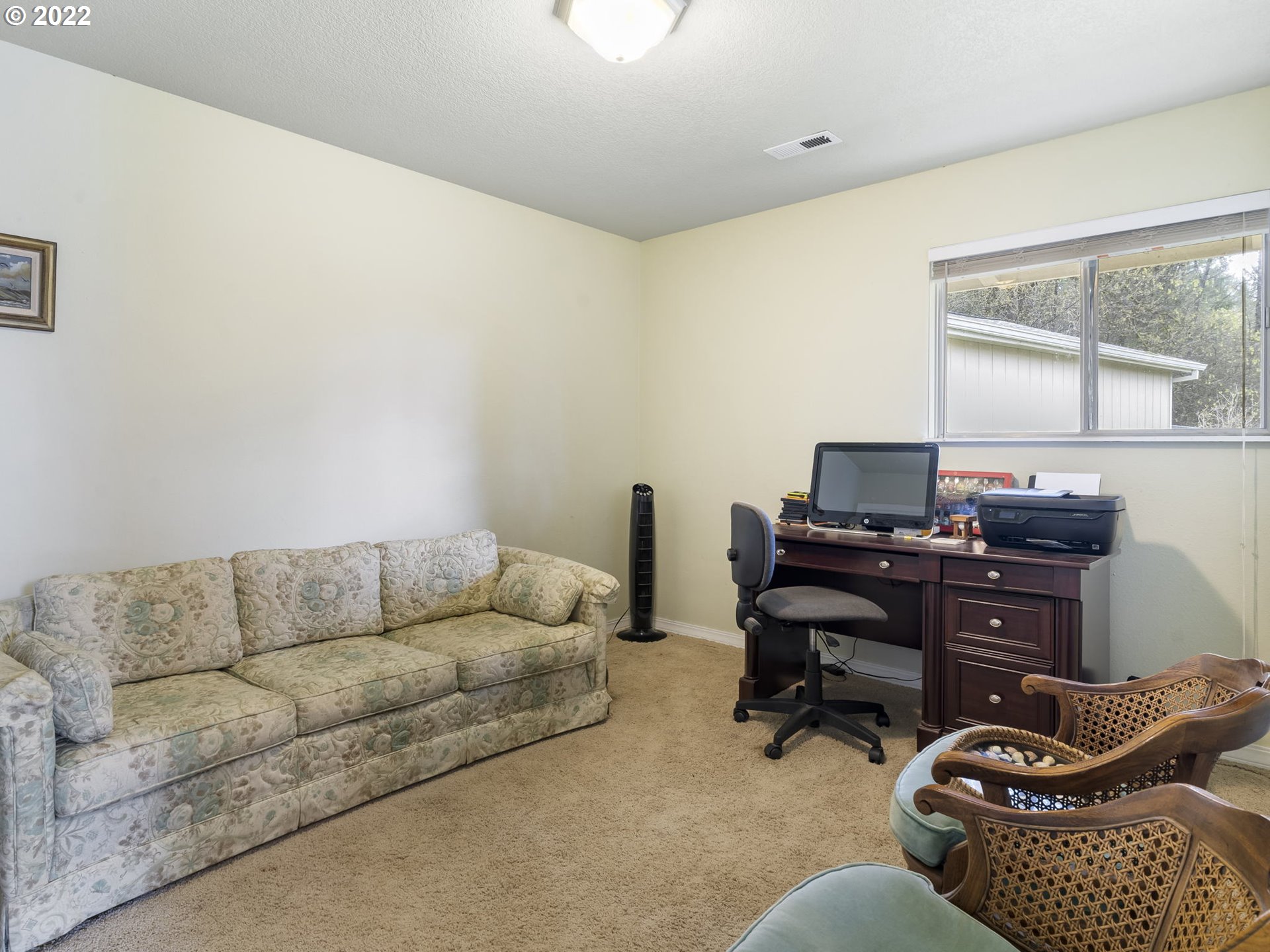 39530 Southwest Gibson Road Gaston, OR 97119 - Photo 22 of 31 a living room with furniture rug and a window