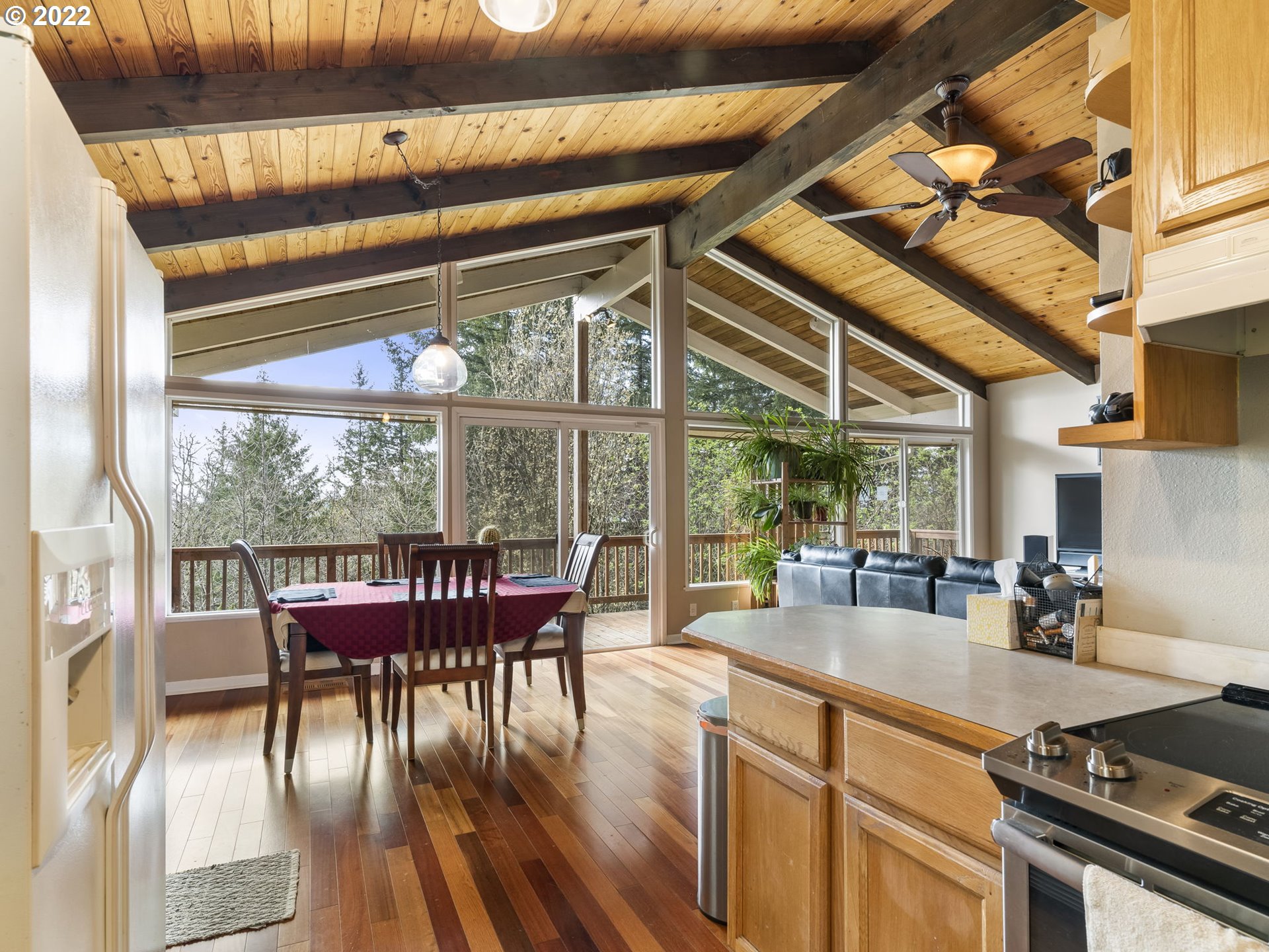 39530 Southwest Gibson Road Gaston, OR 97119 - Photo 6 of 31 a dining room with furniture large windows and wooden floor