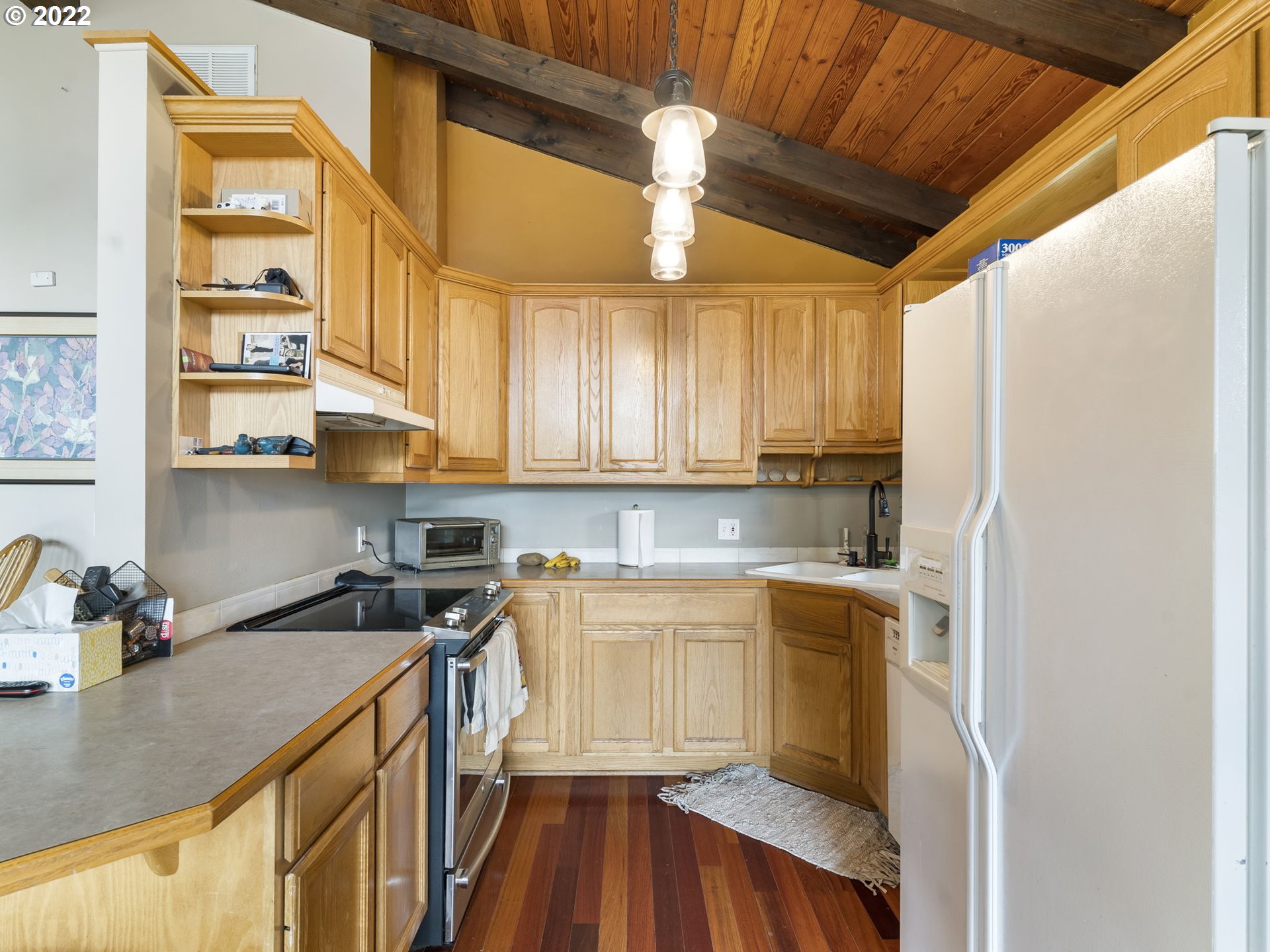 39530 Southwest Gibson Road Gaston, OR 97119 - Photo 8 of 31 a kitchen with a sink a refrigerator and cabinets
