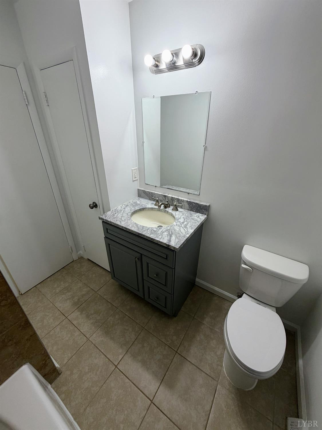 106 Bryant Road Lynchburg, VA 24502 - Photo 11 of 39 a bathroom with a toilet sink and mirror