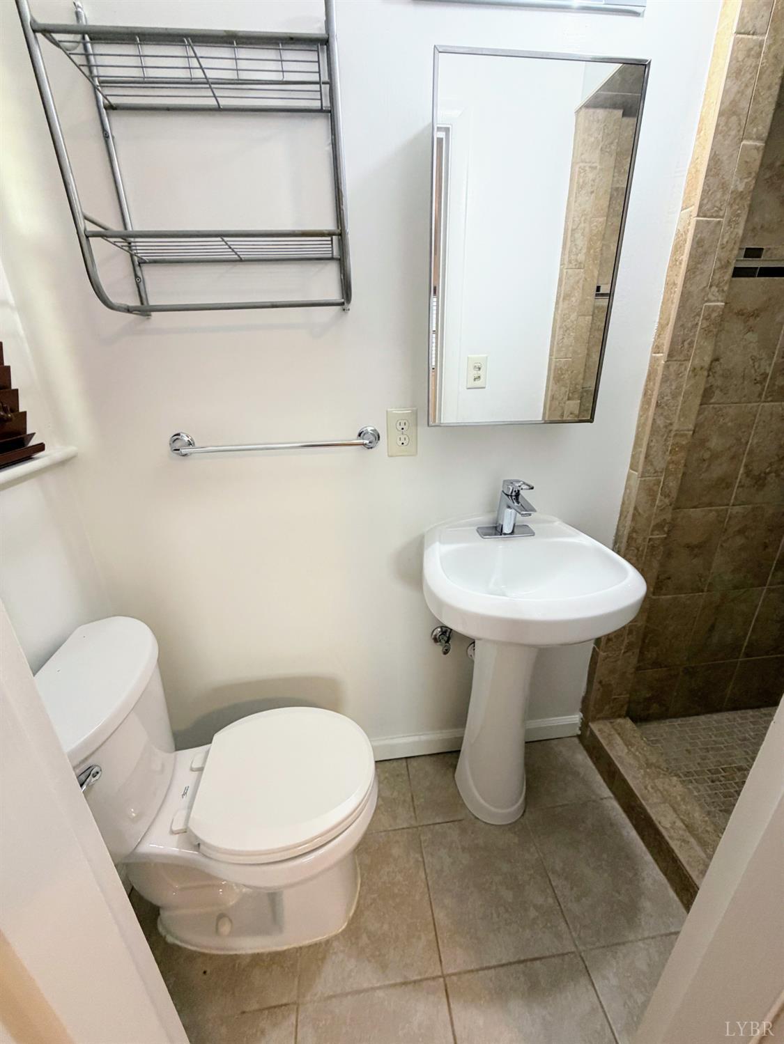 106 Bryant Road Lynchburg, VA 24502 - Photo 14 of 39 a bathroom with a sink toilet and mirror