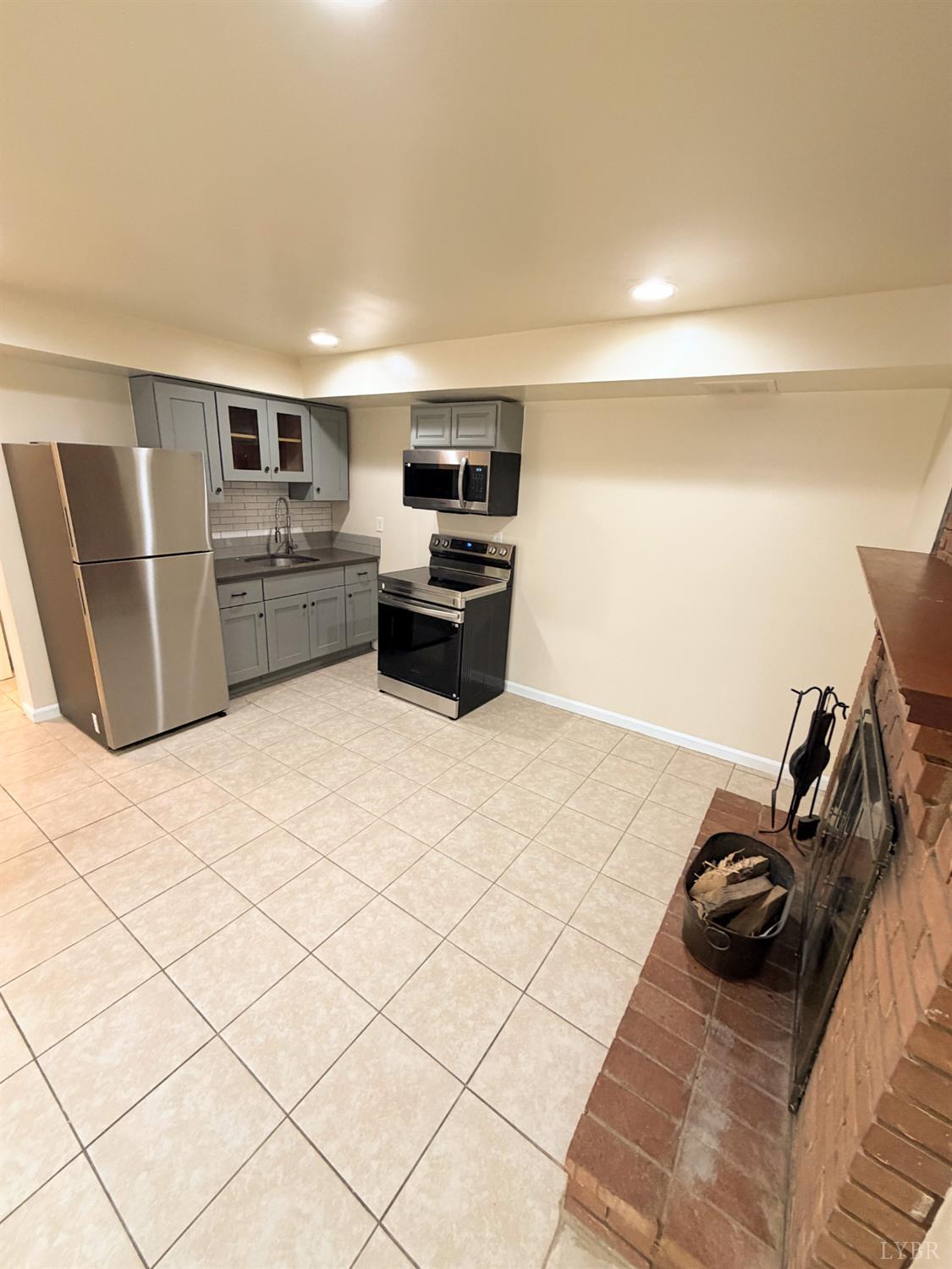 106 Bryant Road Lynchburg, VA 24502 - Photo 27 of 39 a kitchen with a refrigerator and a sink
