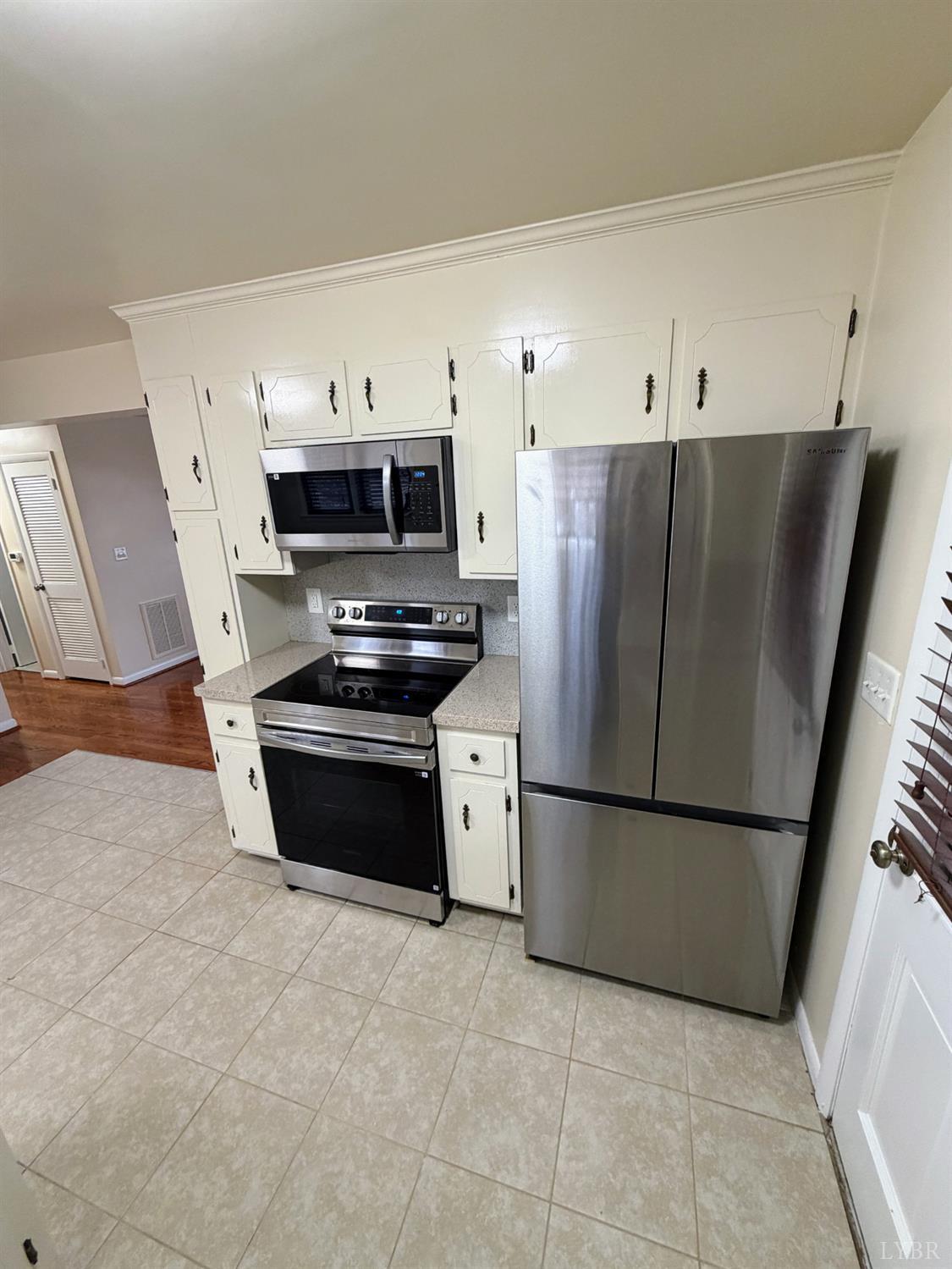 106 Bryant Road Lynchburg, VA 24502 - Photo 5 of 39 a kitchen with stainless steel appliances a refrigerator stove and microwave
