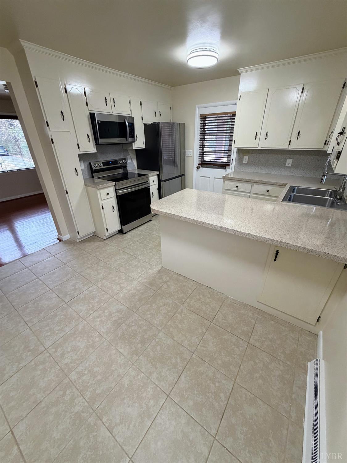 106 Bryant Road Lynchburg, VA 24502 - Photo 6 of 39 a large kitchen with cabinets and a sink
