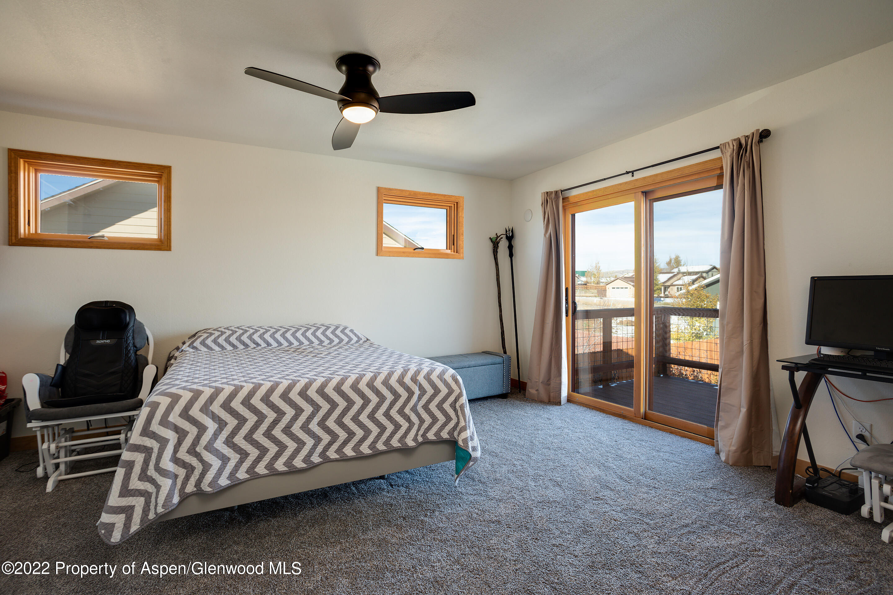 328 Little Bend Road Hayden, CO 81639 - Photo 13 of 27 a bed sitting in a room next to a window