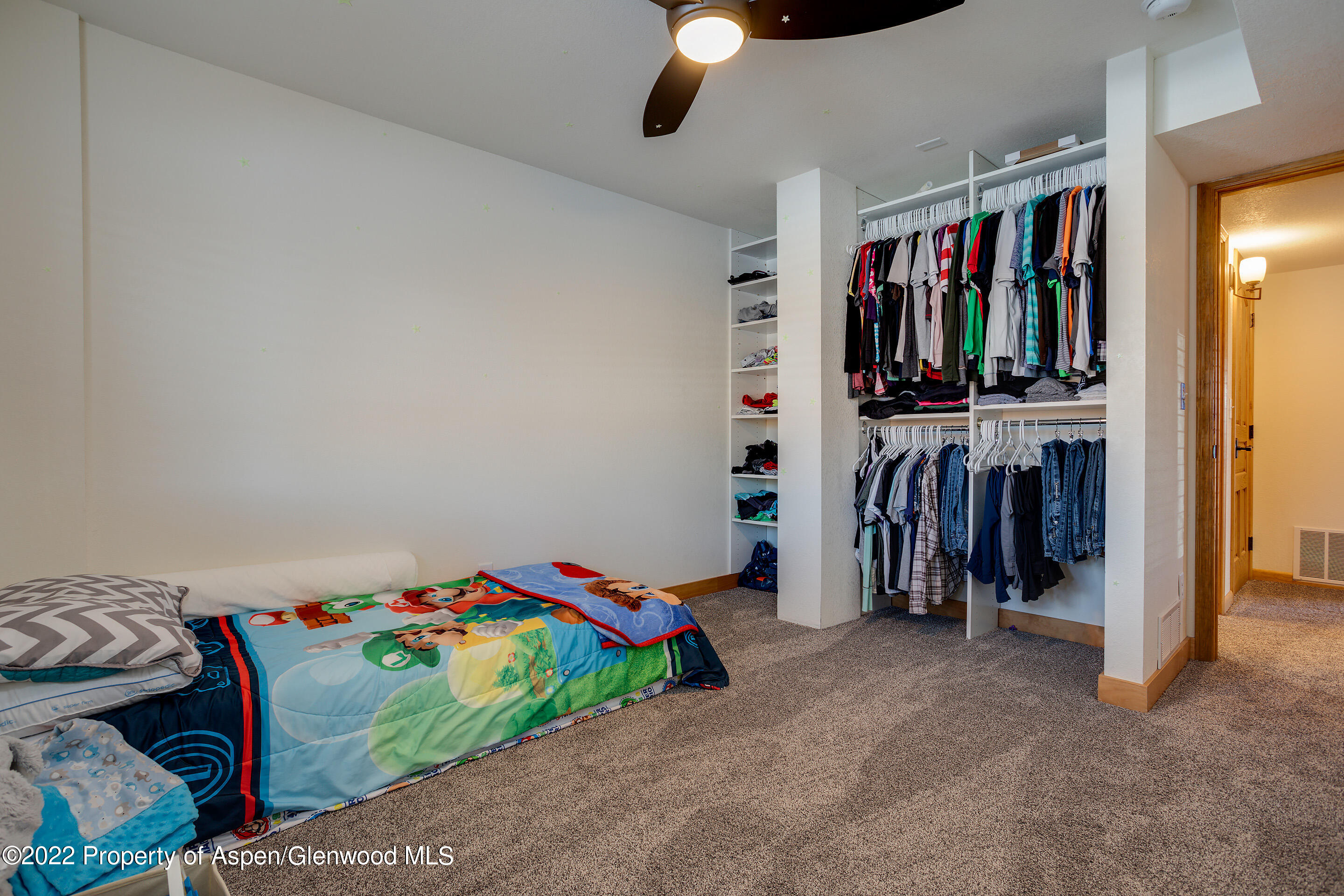 328 Little Bend Road Hayden, CO 81639 - Photo 17 of 27 a bedroom with a bed and a large closet