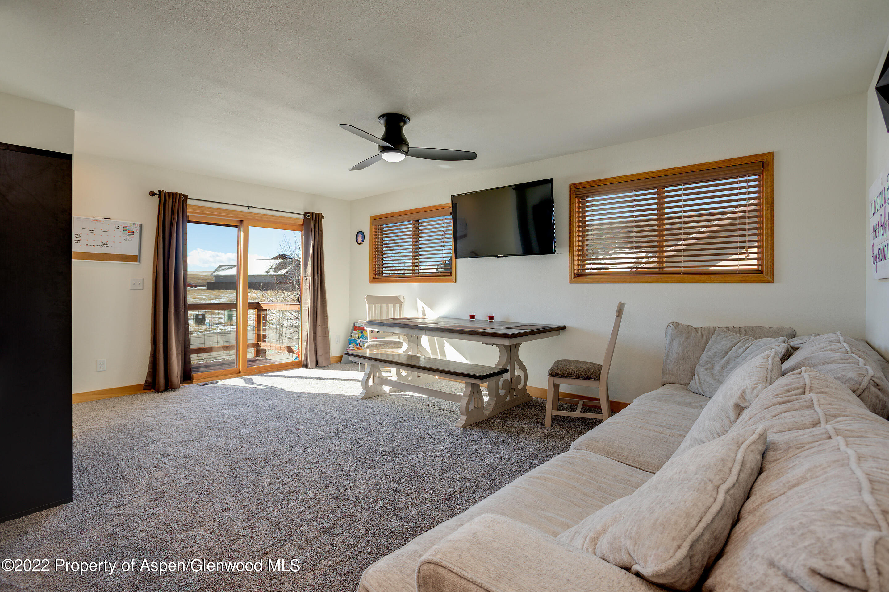 328 Little Bend Road Hayden, CO 81639 - Photo 9 of 27 a living room with furniture and a flat screen tv