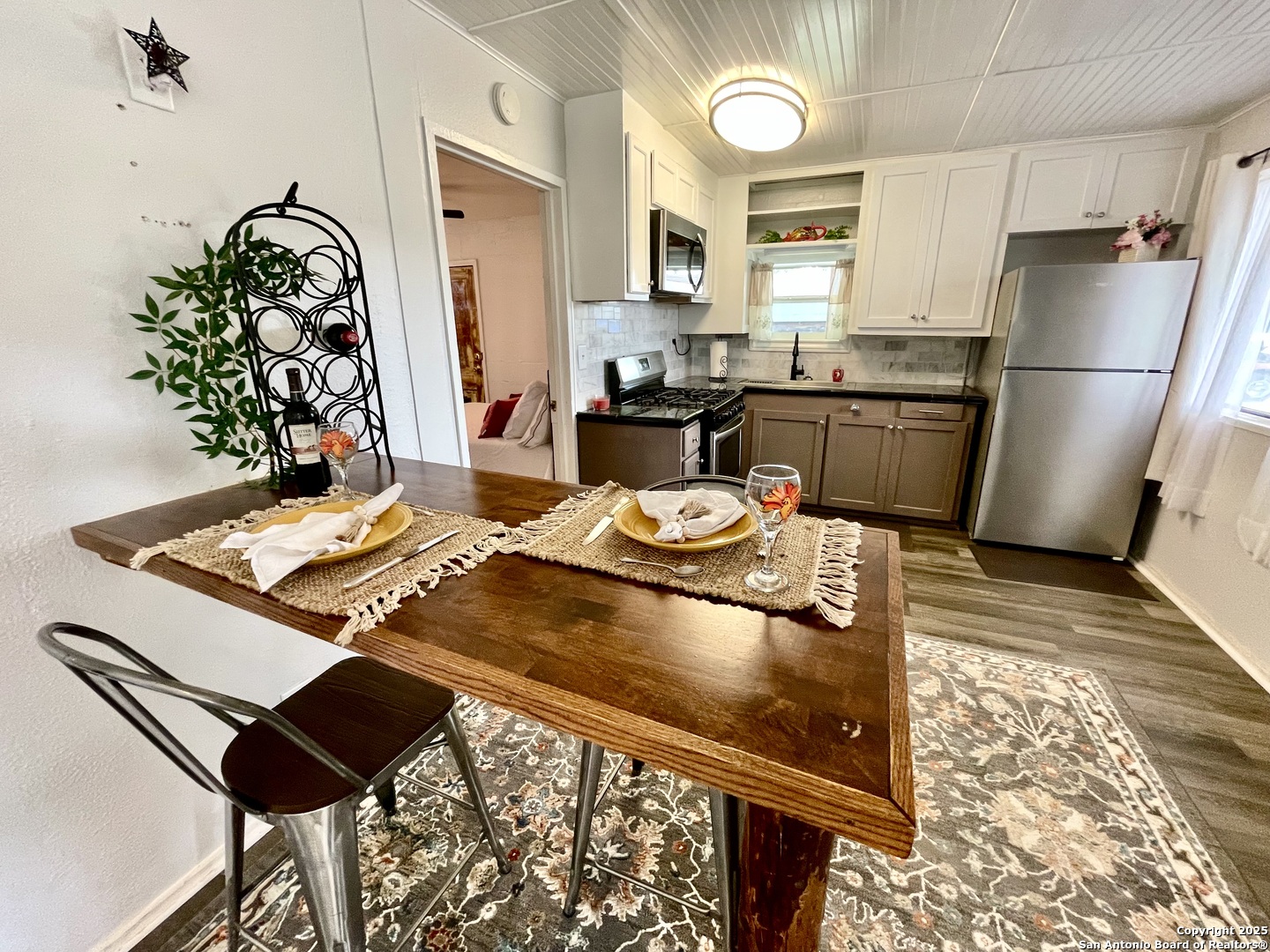 406 Hackberry Street Bandera, TX 78003 - Photo 12 of 34 a kitchen with a refrigerator and a stove top oven