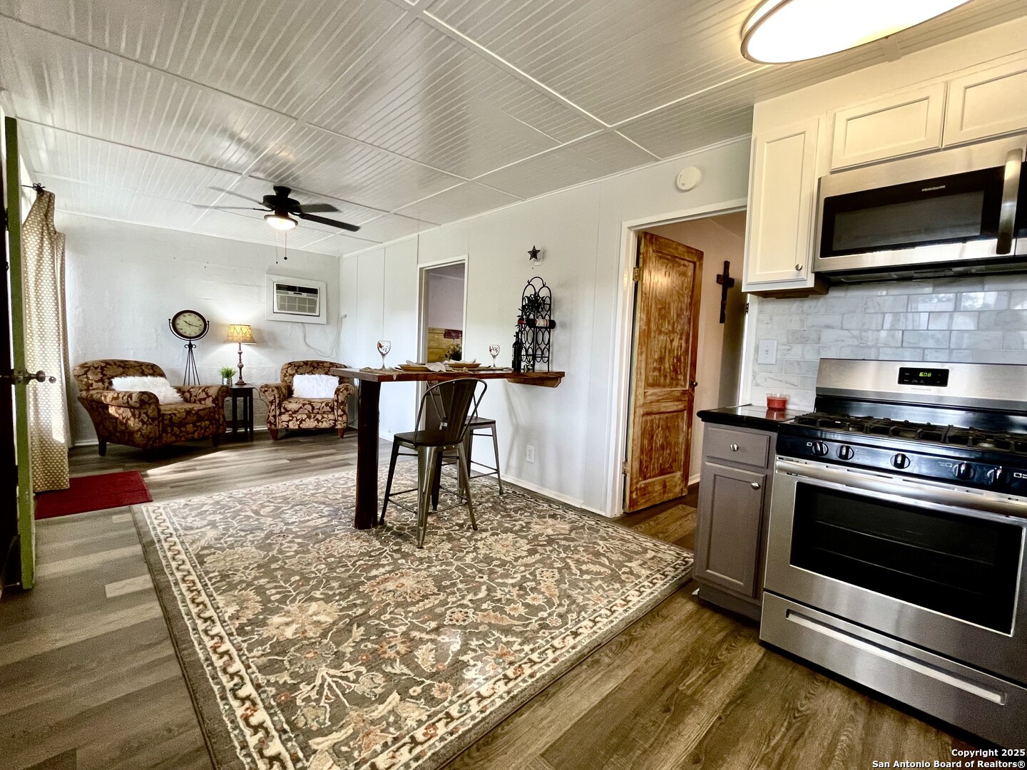 406 Hackberry Street Bandera, TX 78003 - Photo 15 of 34 a kitchen with stainless steel appliances granite countertop a stove refrigerator and a microwave