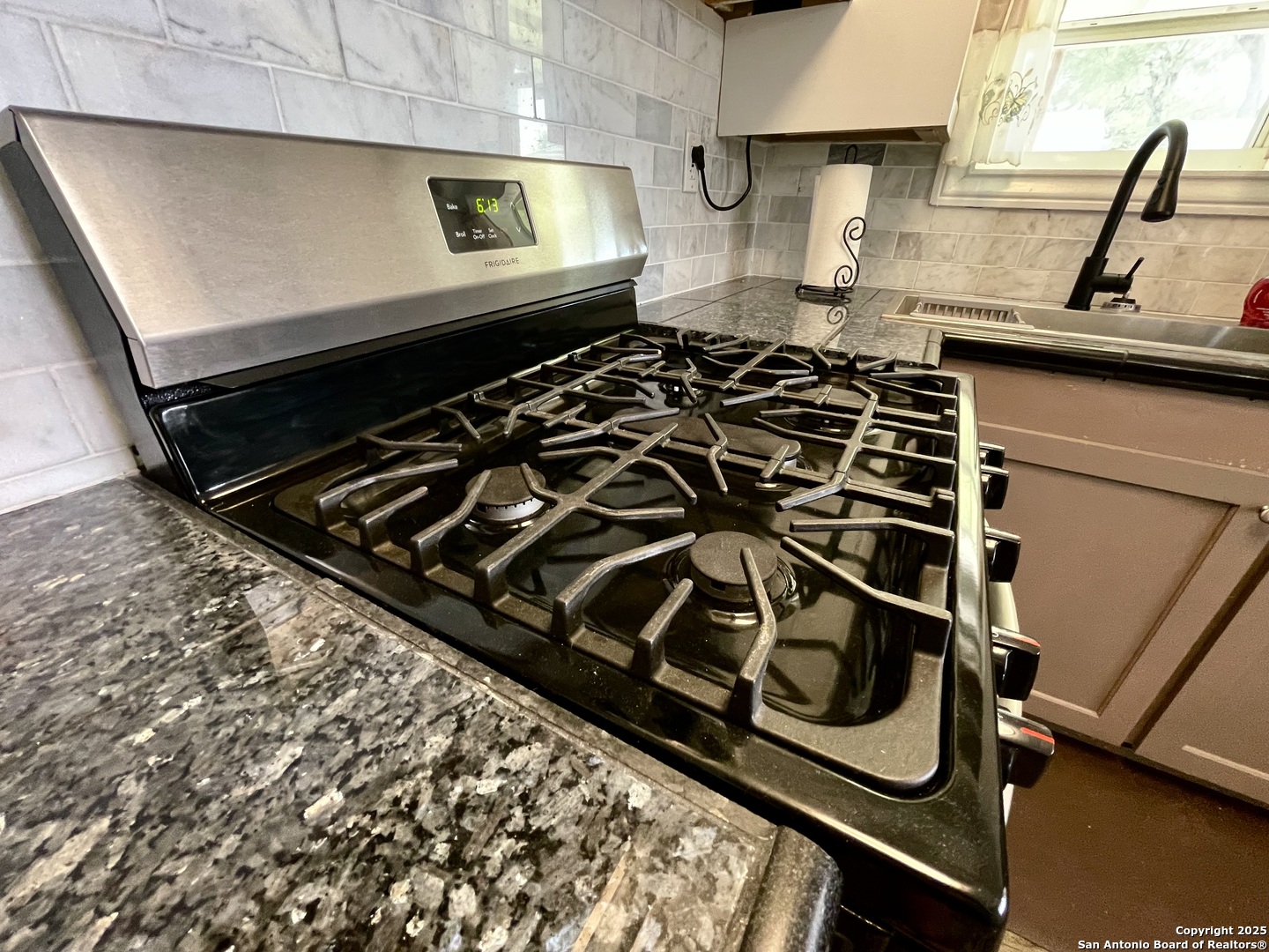 406 Hackberry Street Bandera, TX 78003 - Photo 17 of 34 a kitchen with a stove and a sink