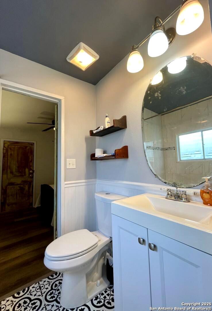 406 Hackberry Street Bandera, TX 78003 - Photo 20 of 34 a bathroom with a sink mirror and toilet