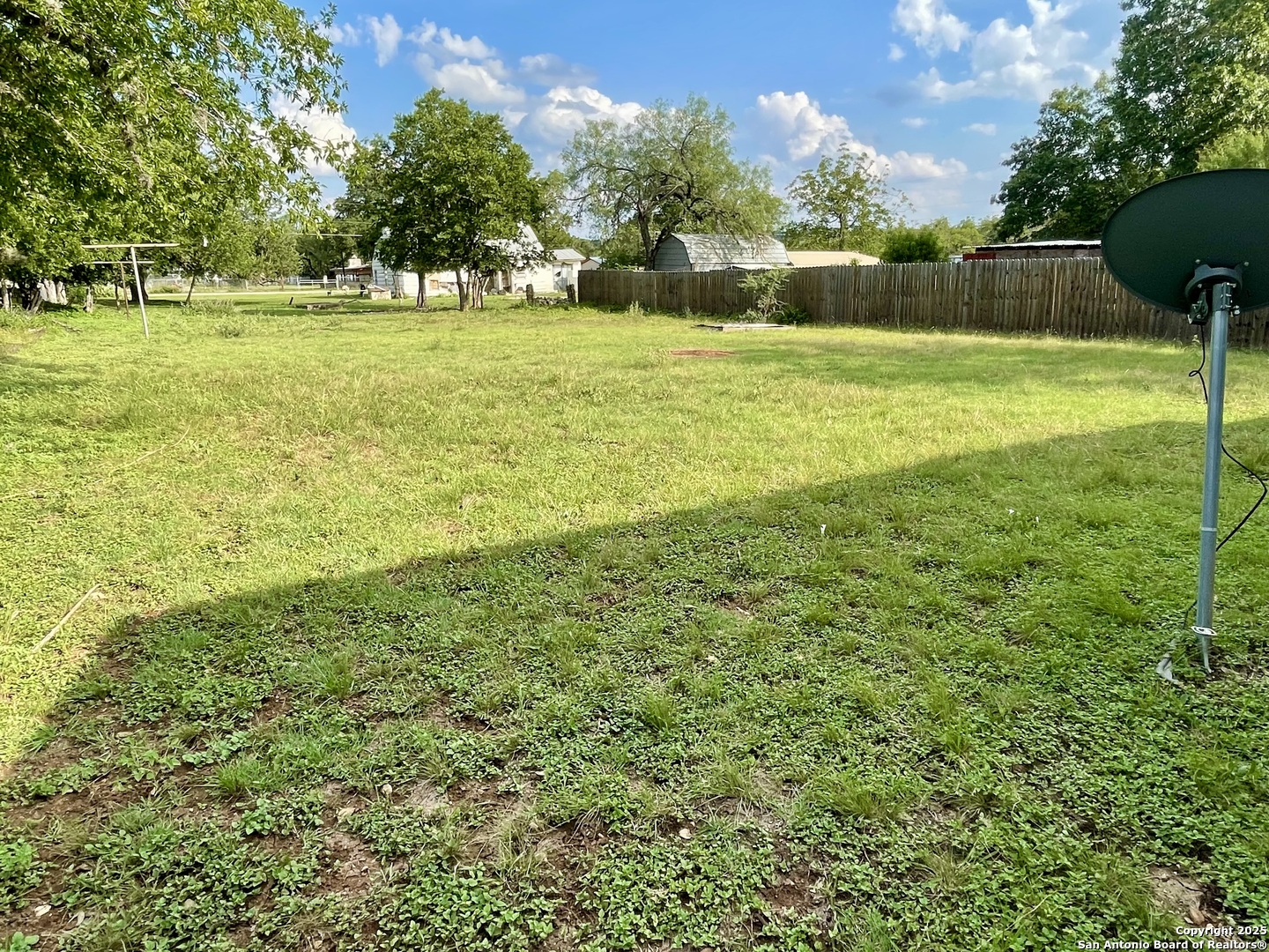 406 Hackberry Street Bandera, TX 78003 - Photo 24 of 34 a view of a field with a tree