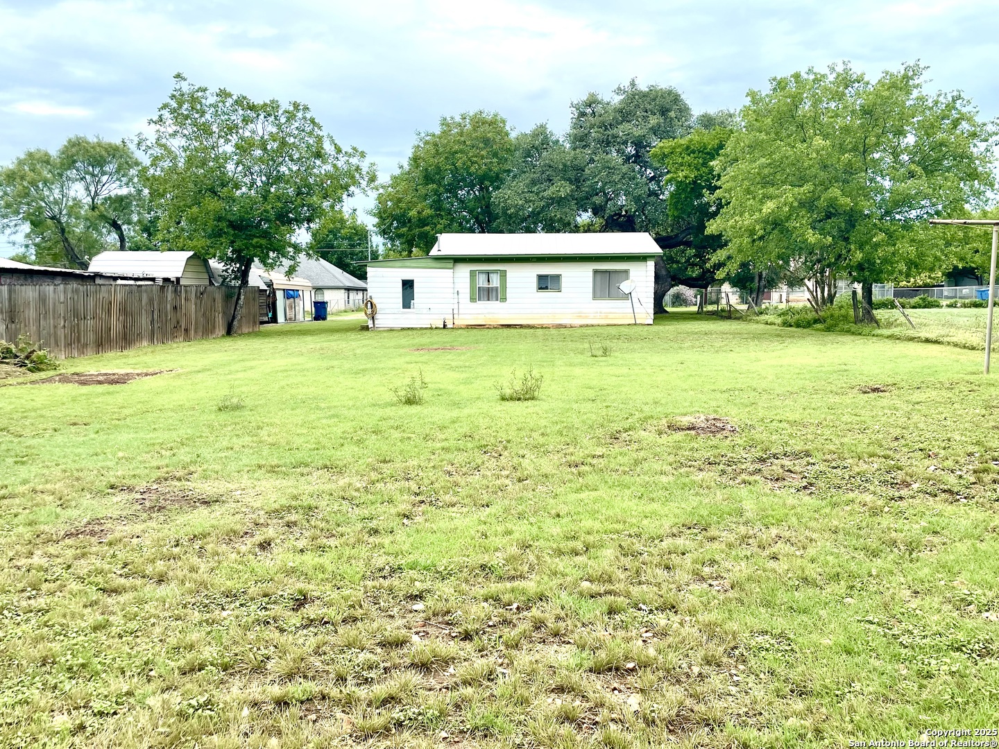 406 Hackberry Street Bandera, TX 78003 - Photo 29 of 34 a front view of a house with garden